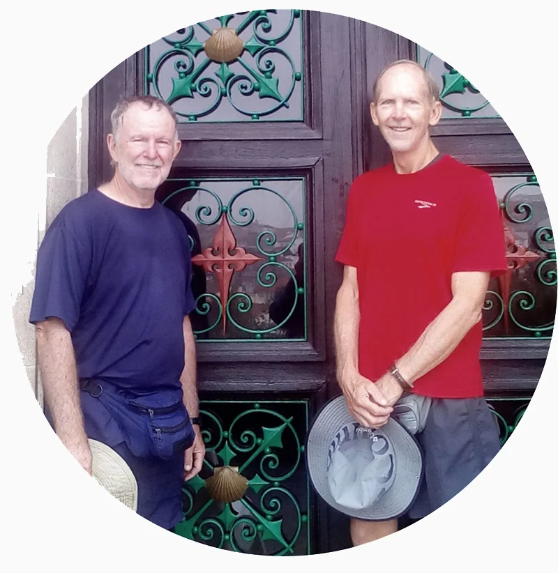 two men standing by a door